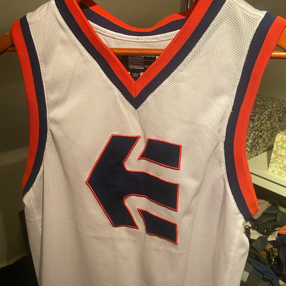 White Basketball Jersey with Red and Blue Accents